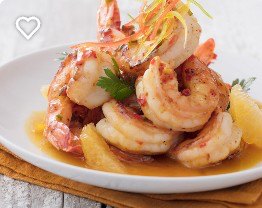 Plate of Florida orange-glazed shrimp with orange segments and parsley